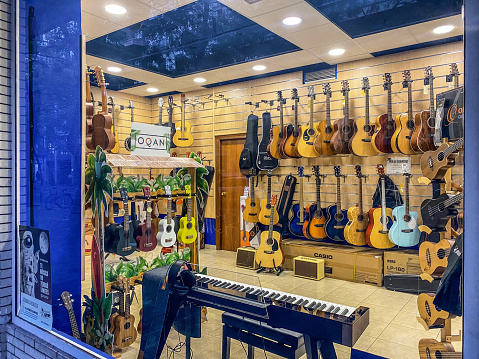 Valencia, Spain - November 5, 2022: View of the interior of a music store. Many people like to play instruments and also learn how to do it and buy them in places like this