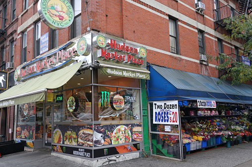 New York, NY - October 24 2022:  A traditional colorful independent New York grocery in the gritty Hell's Kitchen area on 9th Avenue