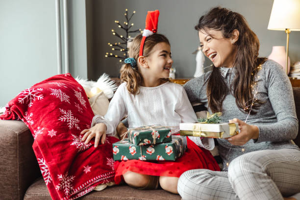 istock A mother gives her daughter a Christmas present 1439605876