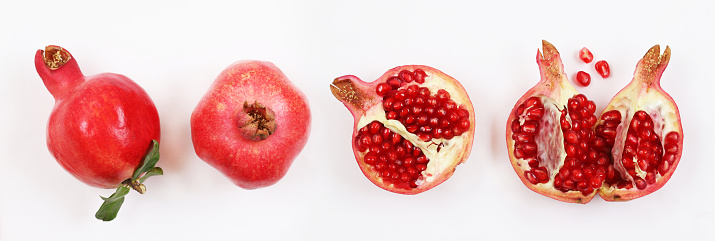 Pomegranate fruits on orange background top view