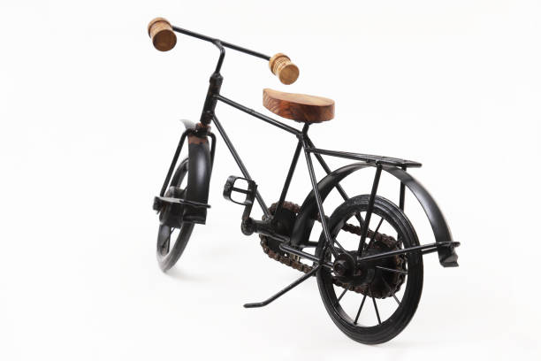 istock Decorative souvenir bicycle on a white background. Shallow depth of field 1439608915