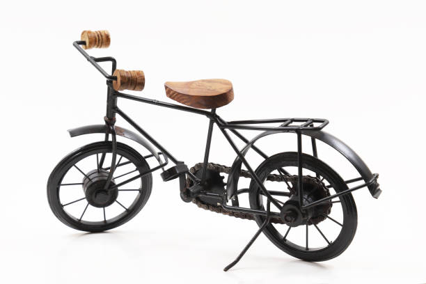 istock Decorative souvenir bicycle on a white background. Shallow depth of field 1439608921