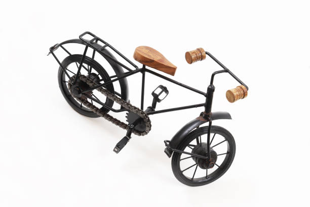 istock Decorative souvenir bicycle on a white background. Shallow depth of field 1439608925