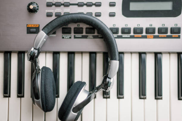 istock High angle view of a headphones on electronic piano keyboard 1439610672