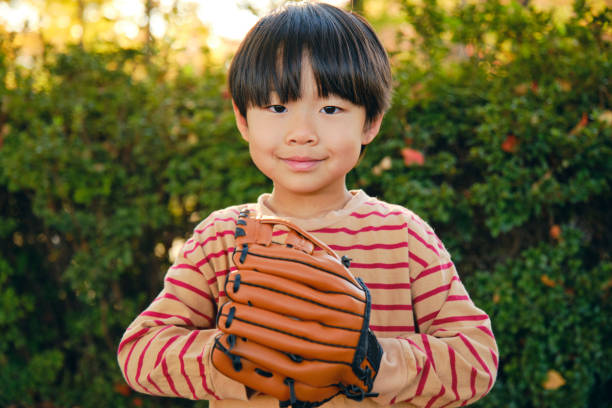 A portrait of a Japanese boy in a park in Tokyo, Japan.