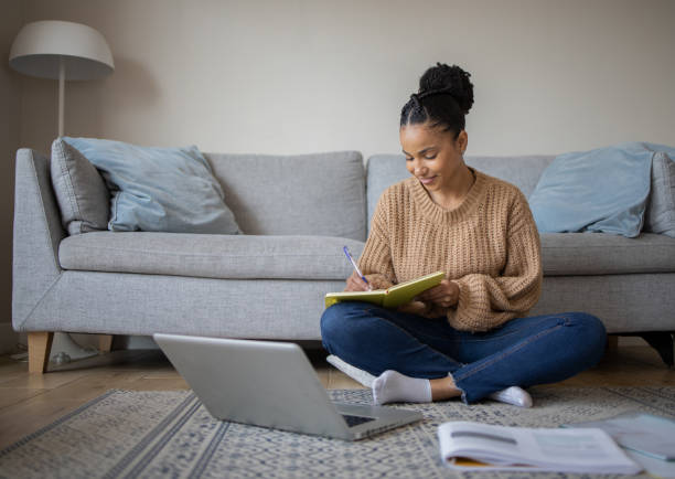 istock Young woman working from home 1439615735