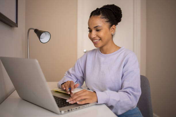 istock Young woman working from home 1439615745