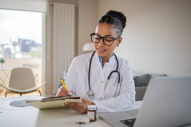 istock Young doctor on a video call with a patient 1439620597