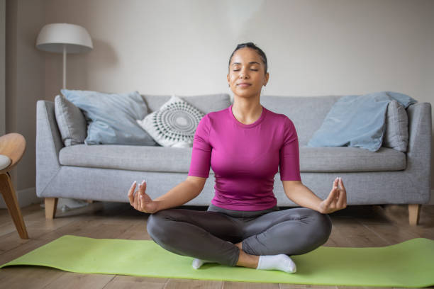 istock Young woman at home keeping fit by exercising 1439622942