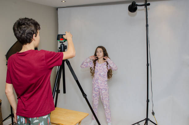 istock Two kids making videos in studio 1439625027