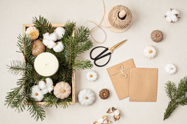 istock Rustic mockup with autumn table decoration. Interior decor for fall holidays with handmade pumpkins. Gift package template. Flatlay, top view 1439625744