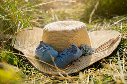 Hat and booties for children on the grass