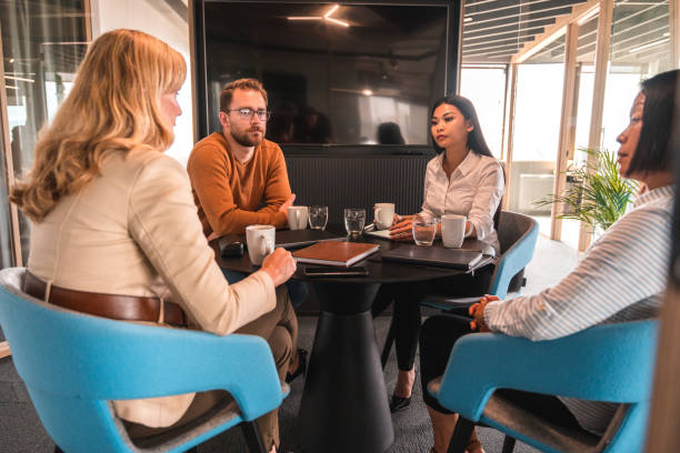 istock International Mixed Race Board Making Decisions In A Meeting 1439628024