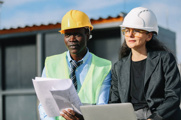 istock architects working on top of the construction site 1439631232