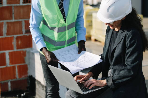 istock architects working on top of the construction site 1439631311
