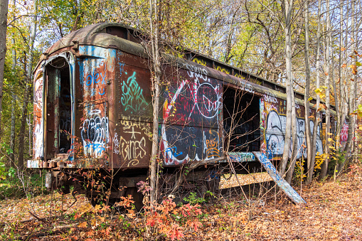 This abandoned train car in Lambertville, NJ, USA, has been covered in graffiti over the years. This is what remains is a CNJ Coash 1318 passenger car purchased in the 1970s by the railroads along the D & R Canal.