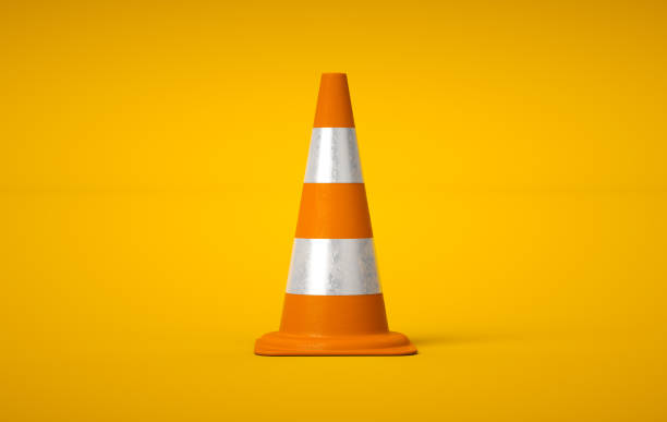 istock 3D orange traffic cone on yellow background. Accident prevention concept. 3D rendering. 1439636786