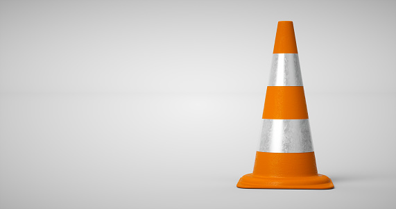 3D orange traffic cone on white background. Accident prevention concept. 3D rendering.