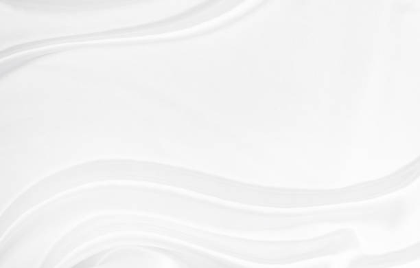istock White gray satin texture that is white silver fabric silk background with beautiful soft blur pattern natural. 1439641574