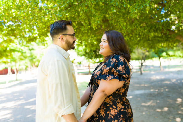 istock Boyfriend and girlfriend in love holding hands on a date 1439643721
