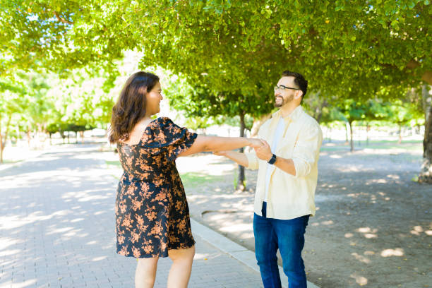 istock Fun boyfriend and girlfriend dancing outdoors 1439643799