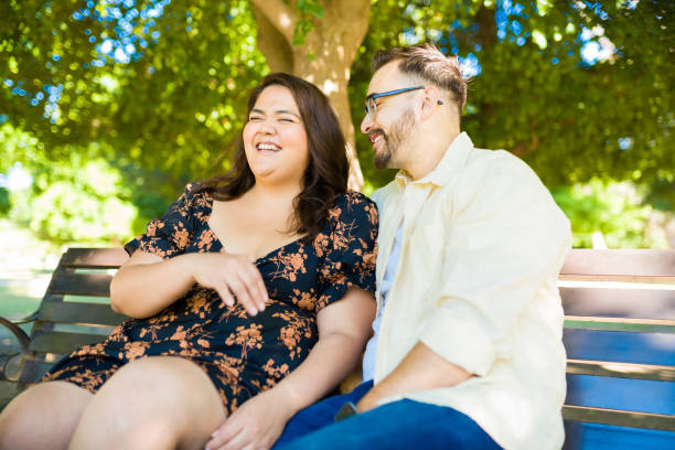 istock Fun man making his girlfriend laugh during a date 1439643928
