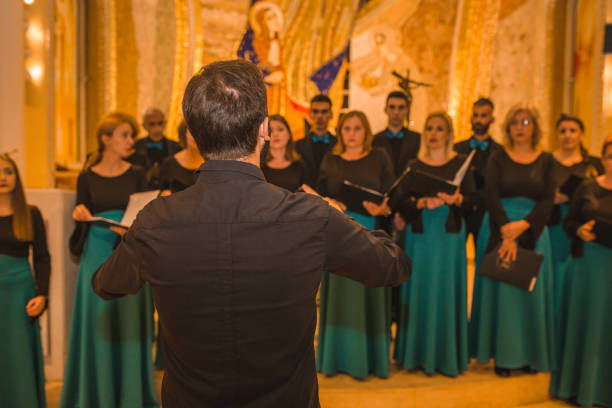 istock Choir practice before the performance in the cathedral with the conductor 1439644629