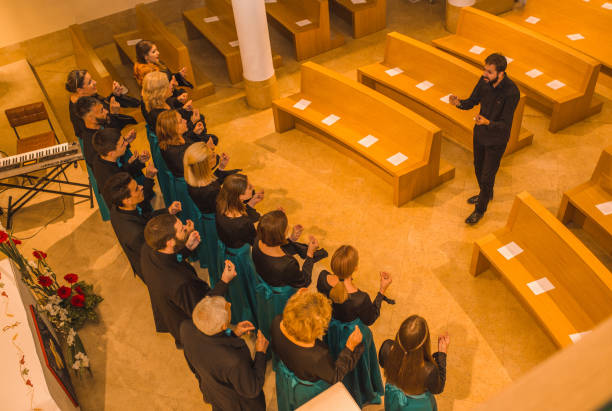 istock The musical conductor and the choir rehearse before the performance 1439649711
