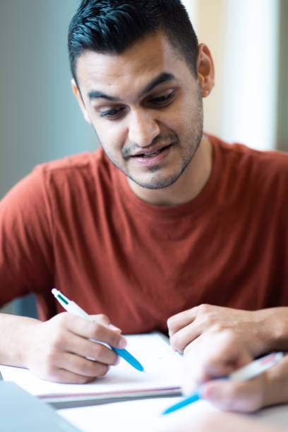 istock Personal  Private Tutor - Student Learning - One on One Teaching - Library - Pen and Paper - Close up Surprised 1439654760