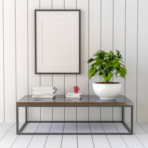 istock Picture frame attached to the wall, with chairs and vases placed on the table. 1439654873