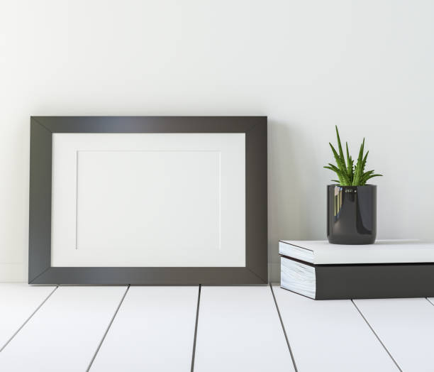 istock A picture frame on the floor with a flower vase. 1439655058