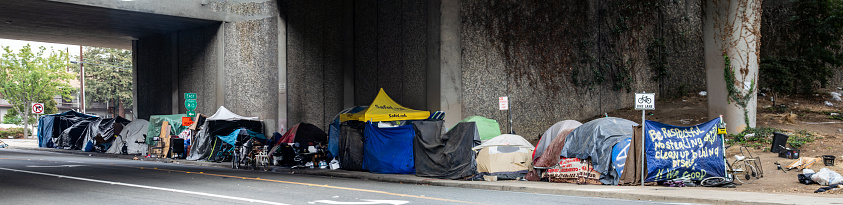 Sacramento, USA November 5, 2022  Panoramic shot of the near entire T Street block's sidewalk under freeway that is filled with homeless tents.. Homeless pictures showing issue in Sacramento. 4 of 6.