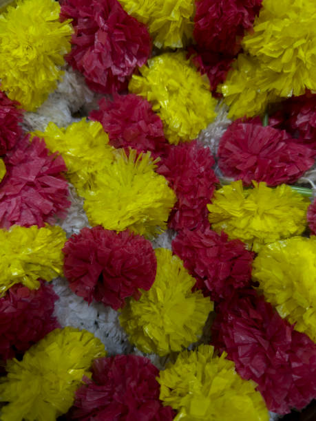 istock YELLOW RED ARTIFICAL FLOWER IN POT 1439656716