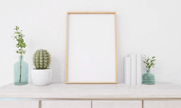 istock Picture frame attached to the wall and has a table at the bottom. 1439657864