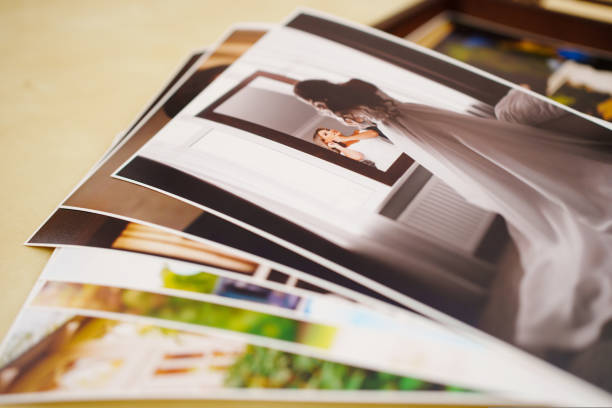 istock printed wedding photos and a wooden box with a flash drive. 1439657977
