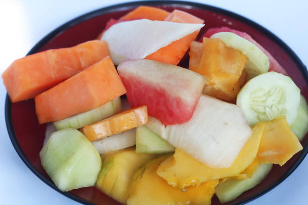 Indonesia salad or rujak, on a plate, healty and stuffed is mango, watermelon, star fruit, yam, cucumber, and papaya.