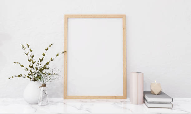 istock A picture frame on the floor with a flower vase. 1439658874