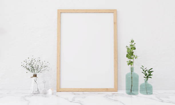 istock A picture frame on the floor with a flower vase. 1439659503