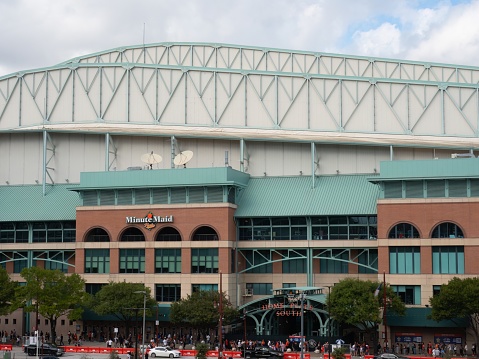 Exterior of the Minute Maid Stadium in Houston, Texas, where the Astros won the 2022 World Series. Fans are lined up to enter the team store.