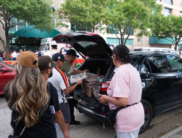 People Standing in Line to Buy Houston Chronicle Newspapers Published after the Houston Astros World Series Win in 2022 Fans standing in line to buy Houston Chronicle newspapers published after the Houston Astros won the World Series in 2022. houston astros stock pictures, royalty-free photos & images