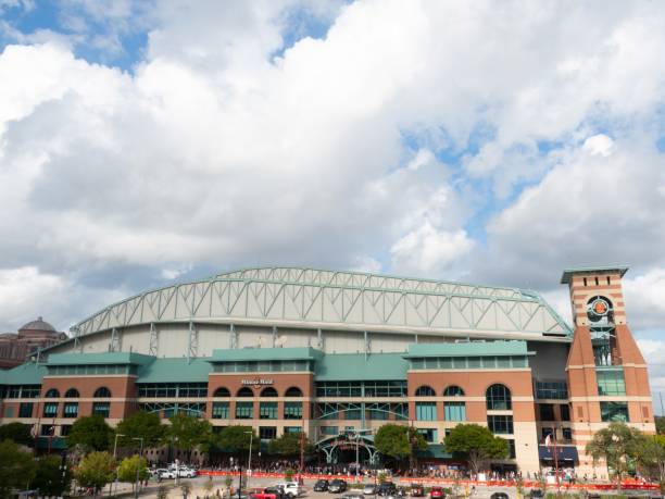 Minute Maid Stadium Exterior in Houston with Astros Fans Lined Up Outside Minute Maid Stadium Exterior in Houston with Astros Fans Lined Up Outside after the Astros' World Series Win in 2022. houston astros stock pictures, royalty-free photos & images