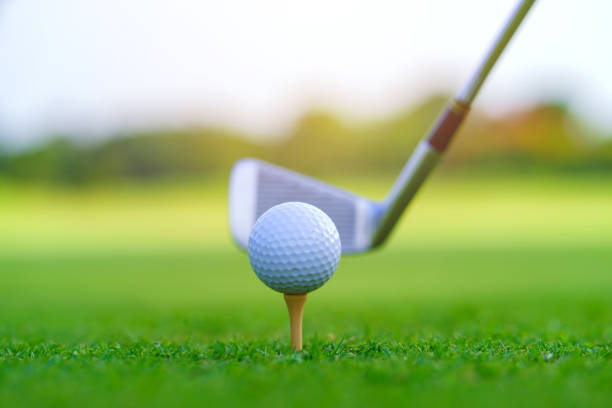 istock Golf ball on green grass ready to be struck on golf course 1439660977