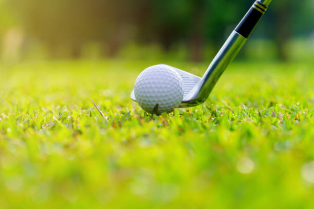 istock Golf ball on green grass ready to be struck on golf course 1439661032