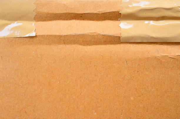 istock brown cardboard paper box, paper textured background 1439661725