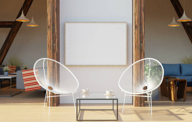 istock Picture frame attached to the wall, with chairs and vases placed on the table. 1439664156
