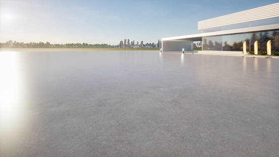 3d rendering of concrete floor or slab, empty space or area at outdoor in perspective view. Include blur modern building exterior of showroom, shop or store. Background design with blue sky and urban city for product display and concept of car sale, auto, automobile, automotive.