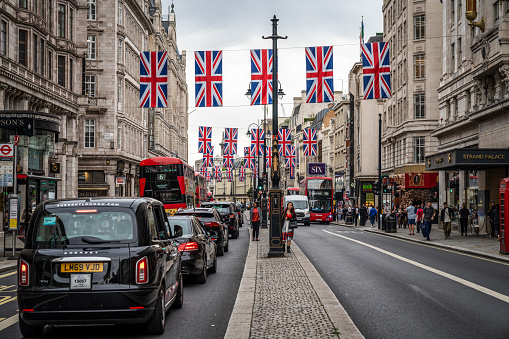London England - May 29 2023: Union Jack Flags Strung Across Regent Street in London England United Kingdom