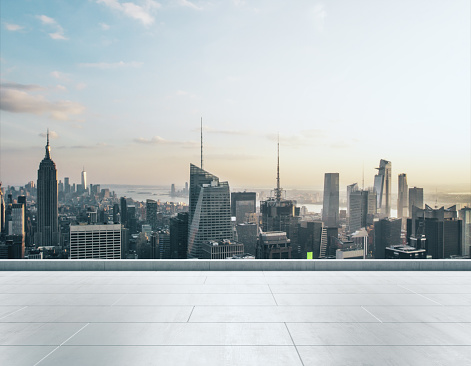 Empty concrete rooftop on the background of a beautiful New York city skyline at daytime, mockup