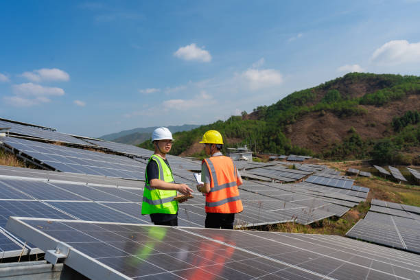 istock Two power engineers are inspecting solar photovoltaic panels 1439668553