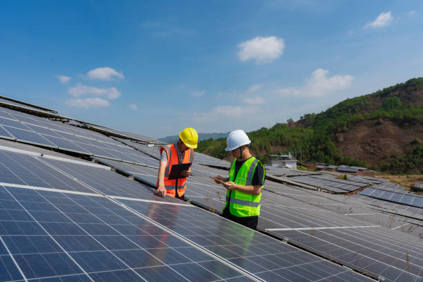 istock Two power engineers are inspecting solar photovoltaic panels 1439668745